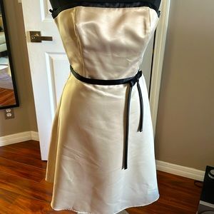 Beige and black satin strapless party dress.